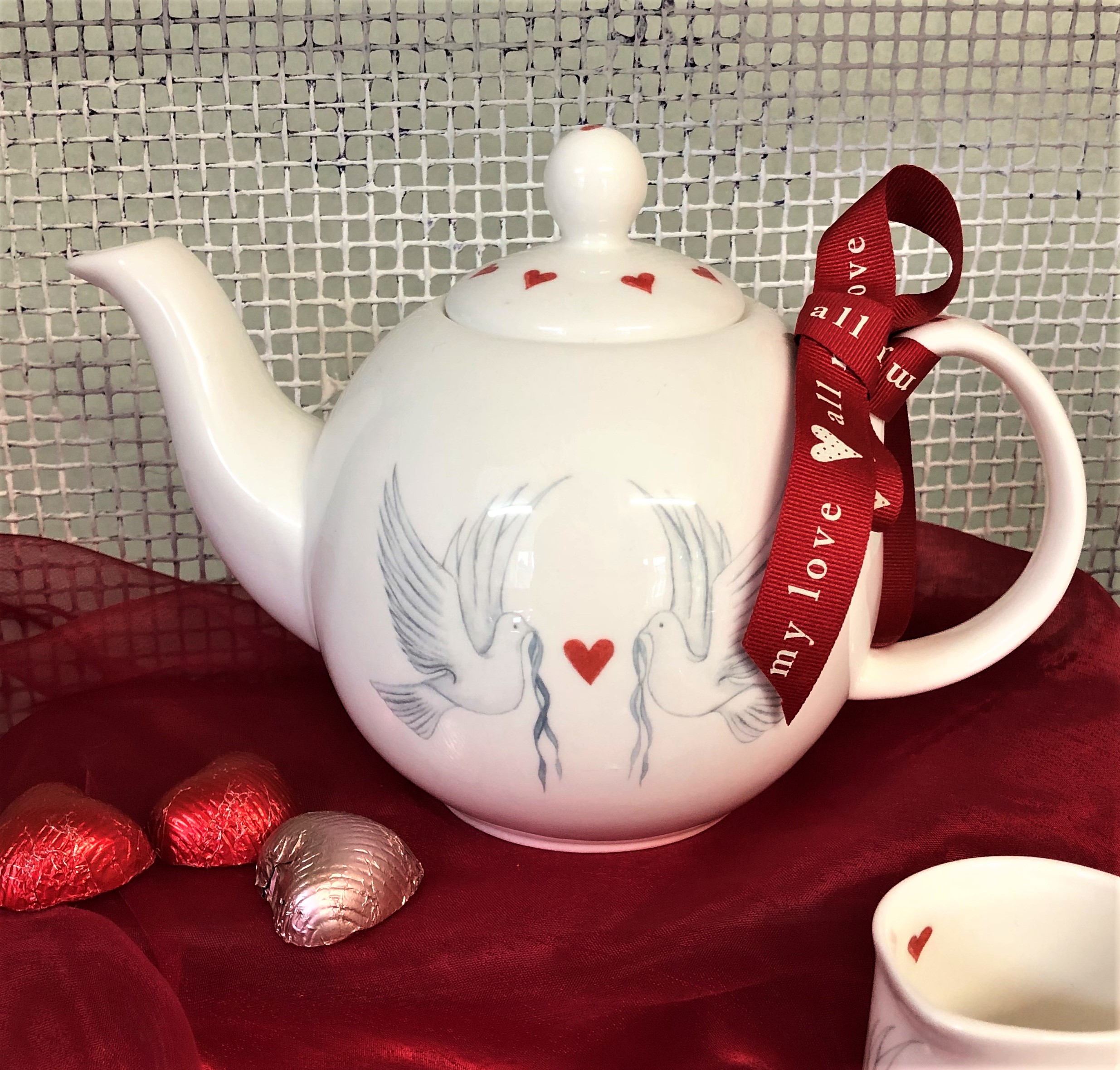 Our bone china Doves and Hearts Collection can have a hand painted inscription added